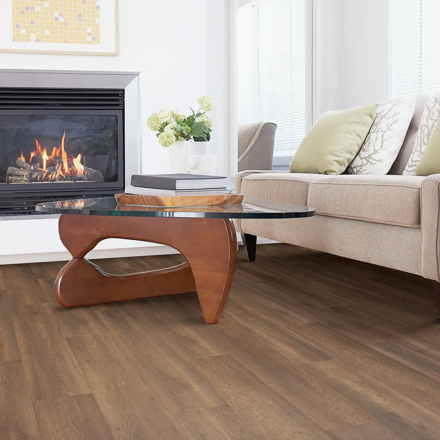 33609_04_room Laminate in a medium brown wood tone in a living room with a fireplace | Donald E. McNabb Flooring